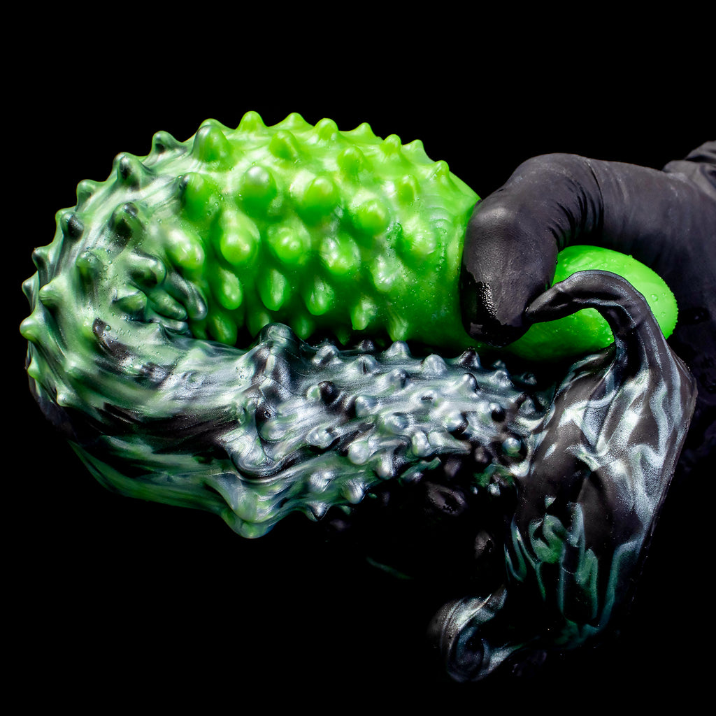 Black "Abyss" spiked dildo by Oieffur, made of platinum silicone, featuring a textured, spiked design for fantasy adult pleasure.