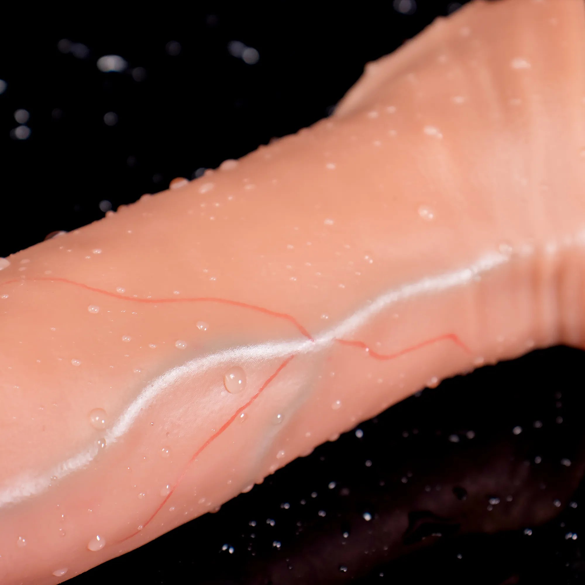 Oieffur Lifelike Sleeve Penis Extender with enhanced length and girth, realistic design, and textured surface for added stimulation.
