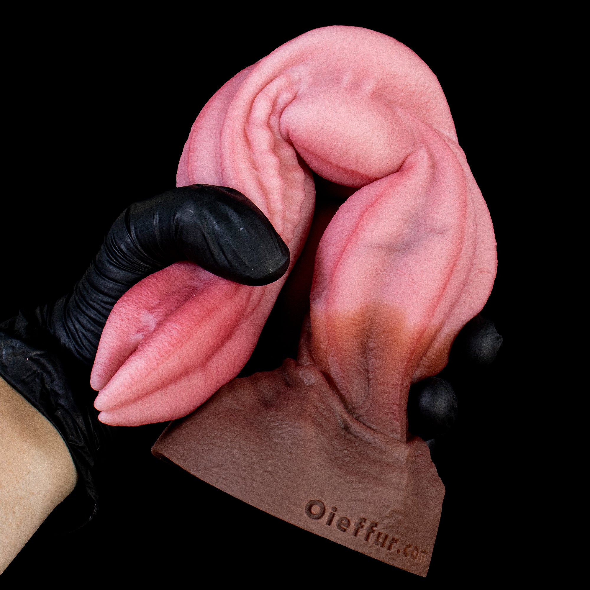 Oieffur Nagaros feathered serpent god platinum silicone fantasy dildo with detailed serpent design and vibrant feathered accents.