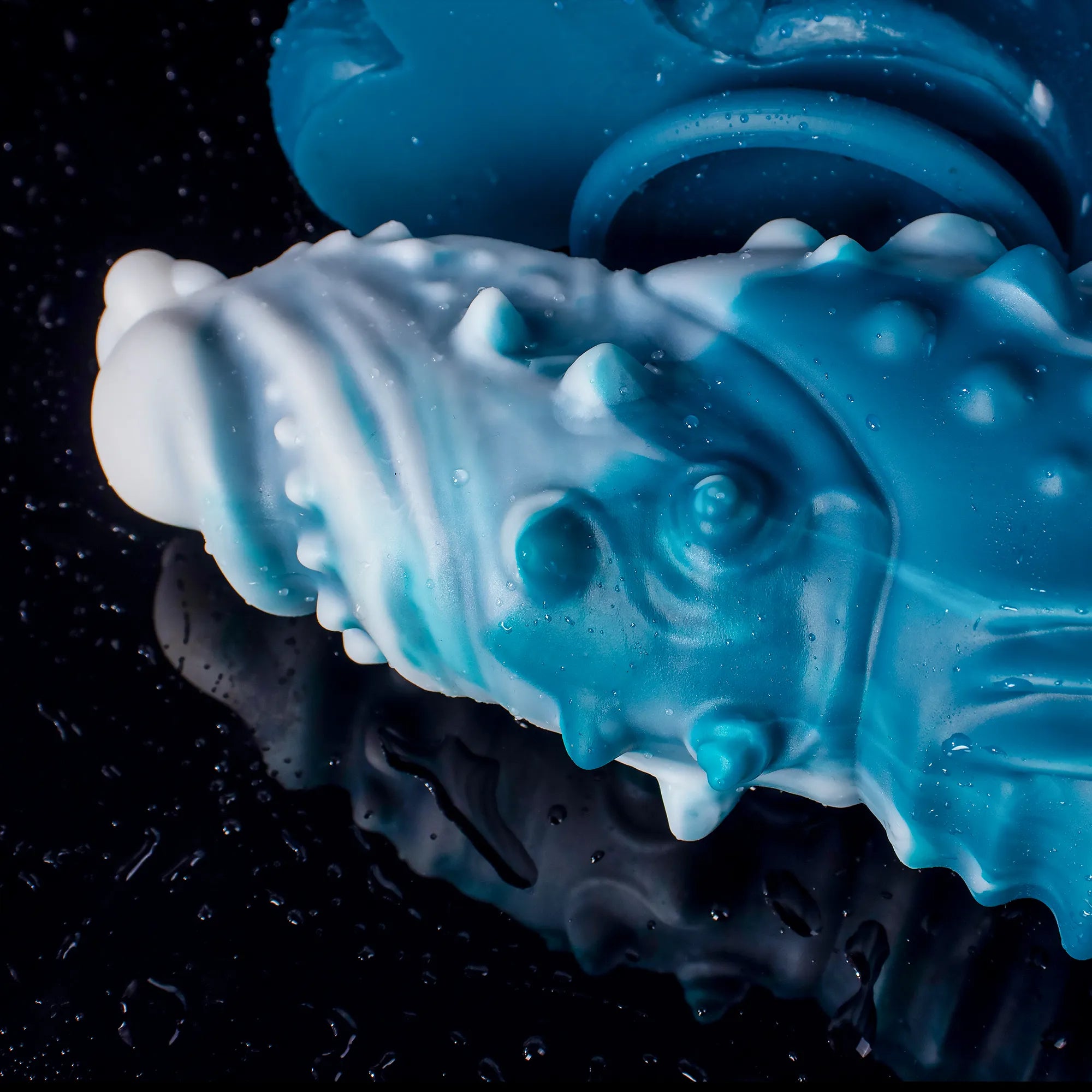 Oieffur Koopa silicone monster dildo with suction cup, displayed in various sizes, showcasing the textured surface and flexible design.